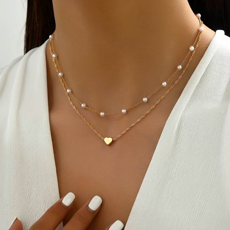 Collar doble con perlas y colgante de corazón