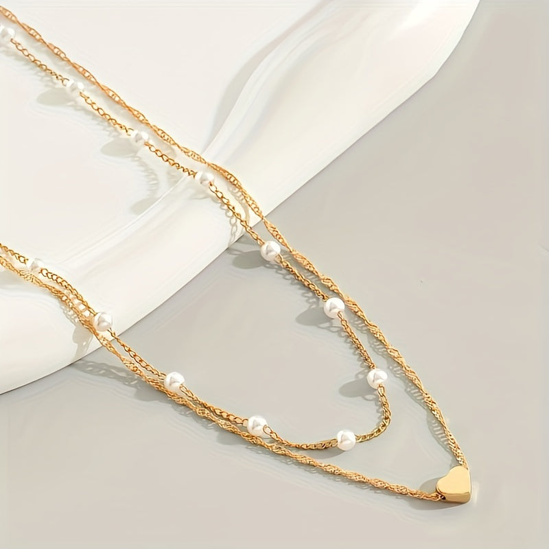Collar doble con perlas y colgante de corazón