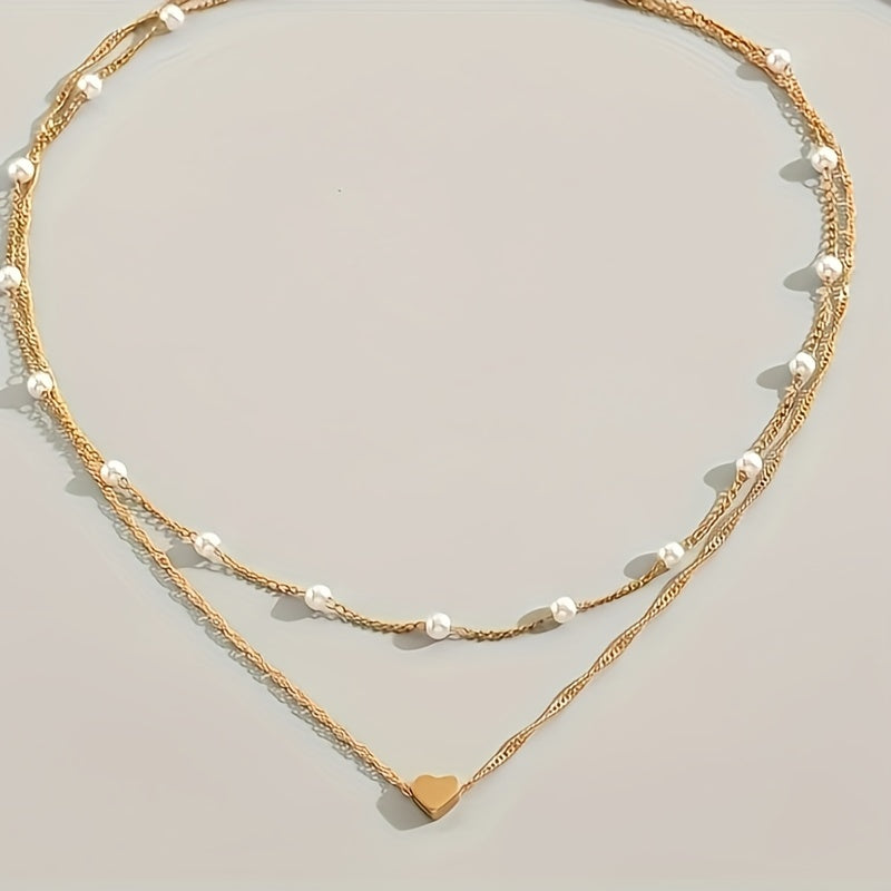Collar doble con perlas y colgante de corazón